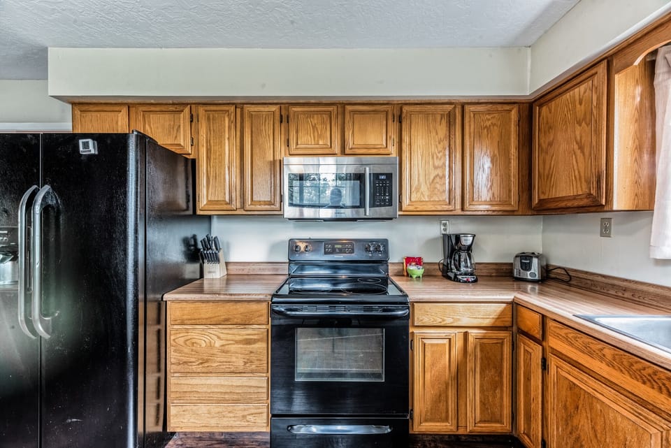 House, Multiple Beds, Fireplace, River View | Private kitchen | Coffee/tea maker, fridge, microwave, oven