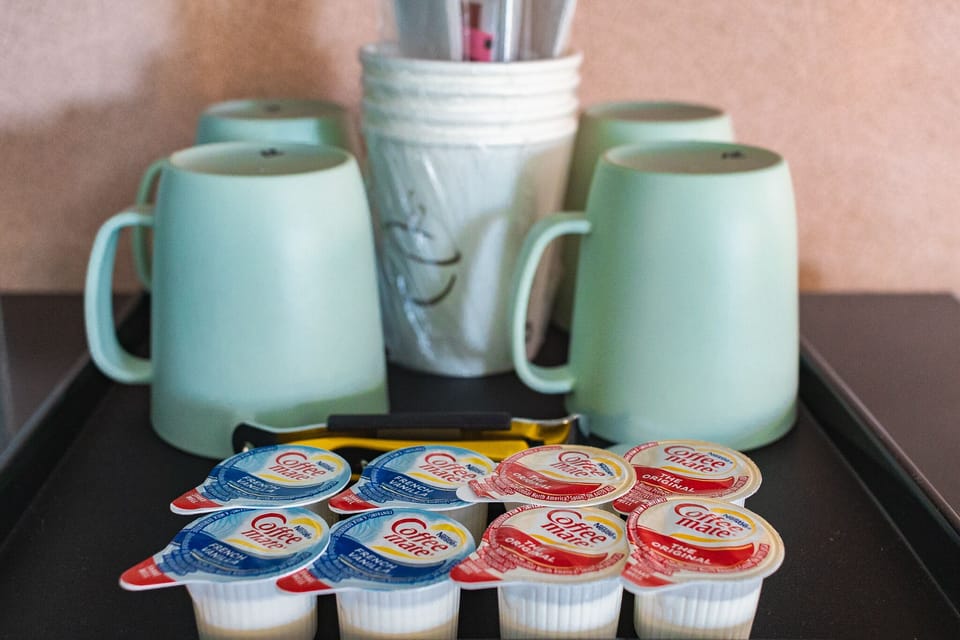 Deluxe Suite, 1 Bedroom, Kitchen, Pool View | Private kitchen | Microwave, coffee/tea maker, cleaning supplies, paper towels
