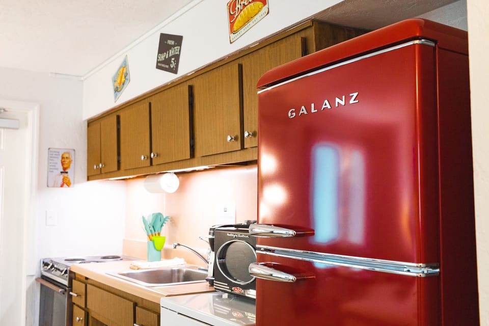 Family Suite, 1 Bedroom, Kitchen, Pool View | Private kitchen | Microwave, coffee/tea maker, cleaning supplies, paper towels