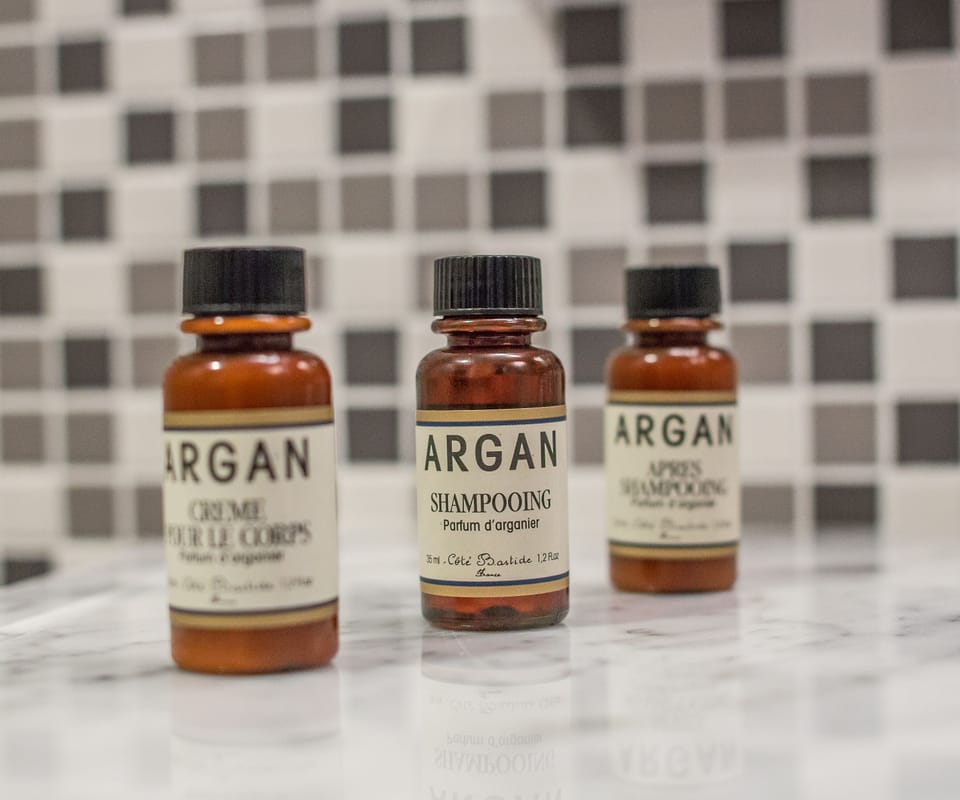 Shower, rainfall showerhead, designer toiletries, hair dryer