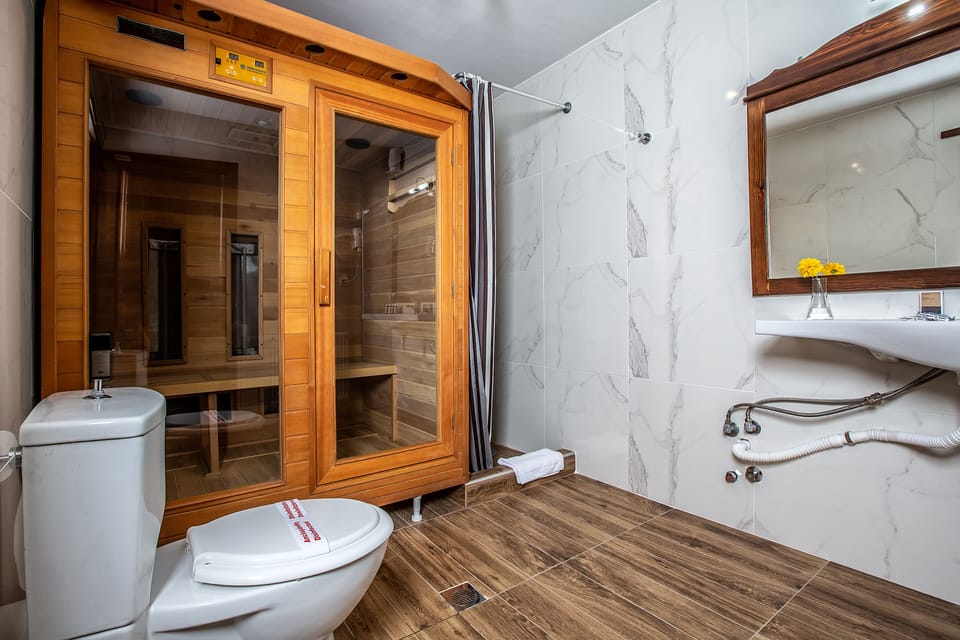 Junior Suite, Sauna | Bathroom | Shower, bathrobes, towels