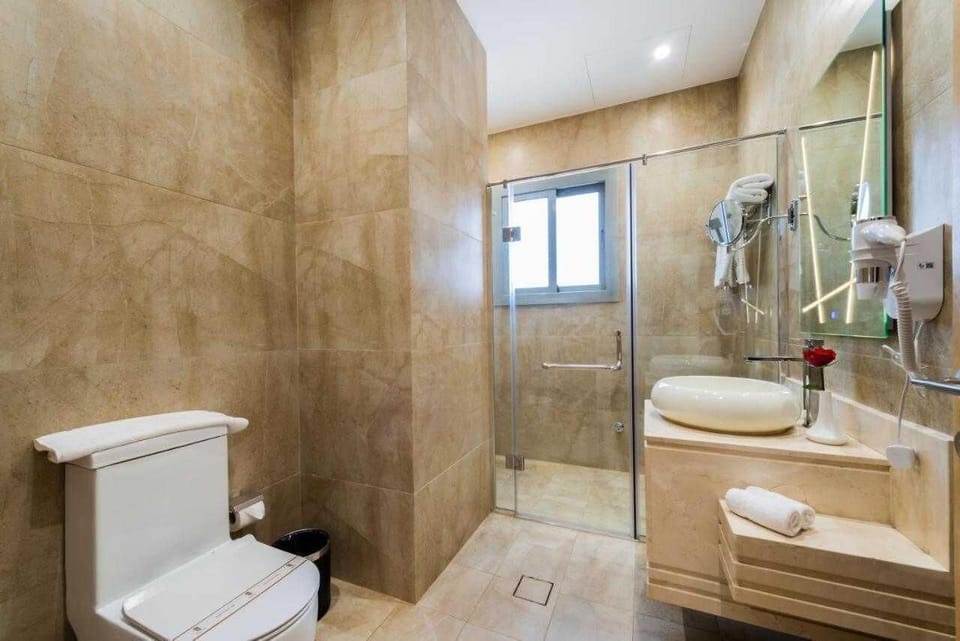 Separate tub and shower, rainfall showerhead, designer toiletries