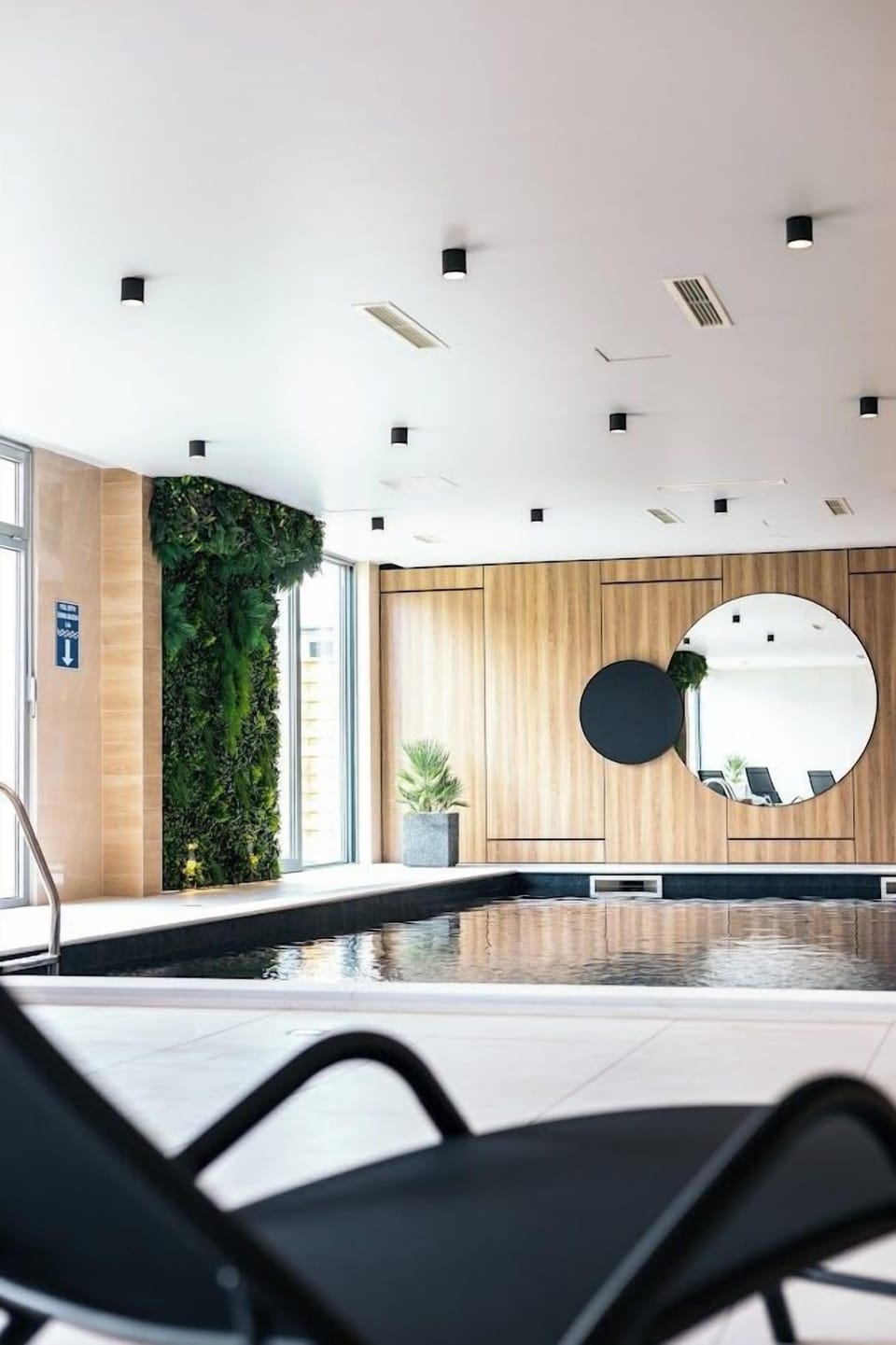 Indoor pool, open 9:00 AM to 10:00 PM, pool umbrellas