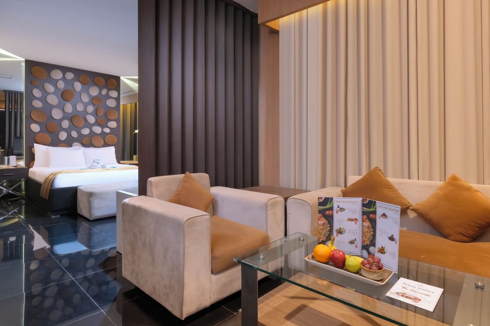 The Residence | Living area | Flat-screen TV, fireplace
