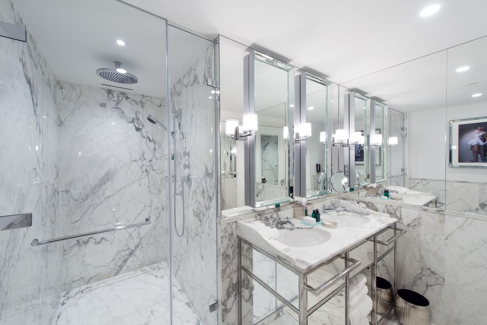 Deluxe Room, 1 King Bed | Bathroom | Designer toiletries, hair dryer, bathrobes, slippers