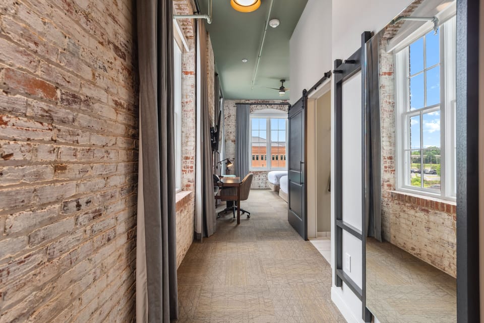 Corner Room, 2 Queen Beds, River View | Desk, laptop workspace, iron/ironing board, free WiFi