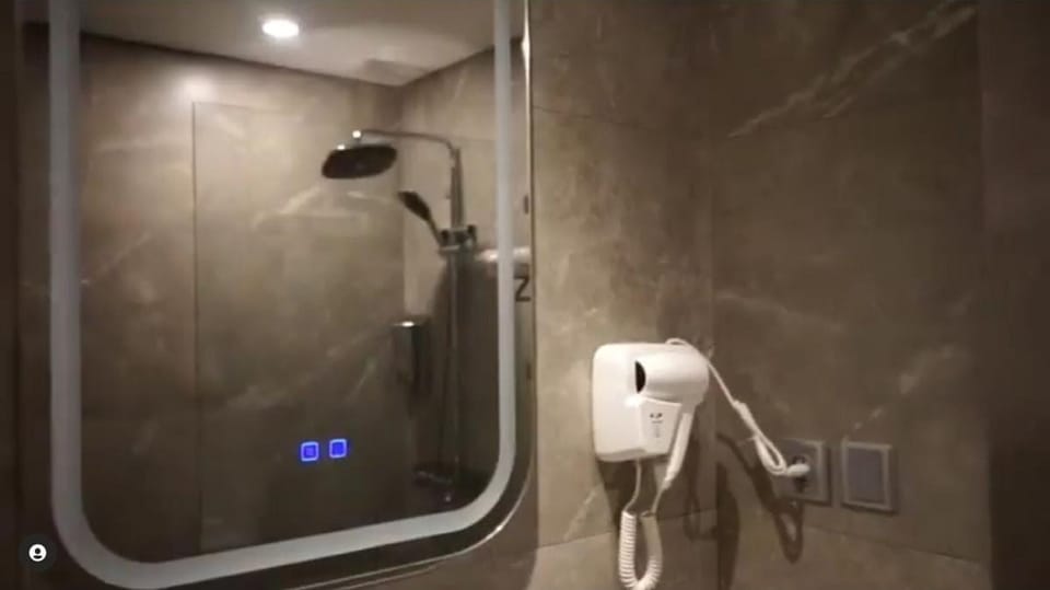 Shower, bathrobes, towels