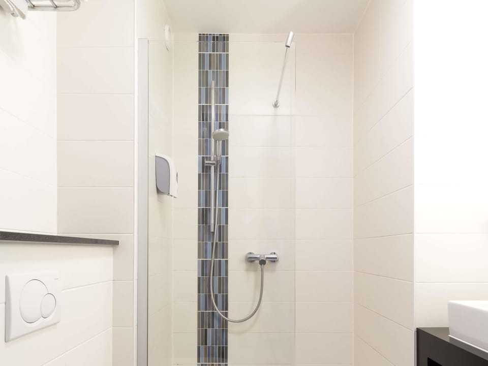 Shower, eco-friendly toiletries, hair dryer, towels