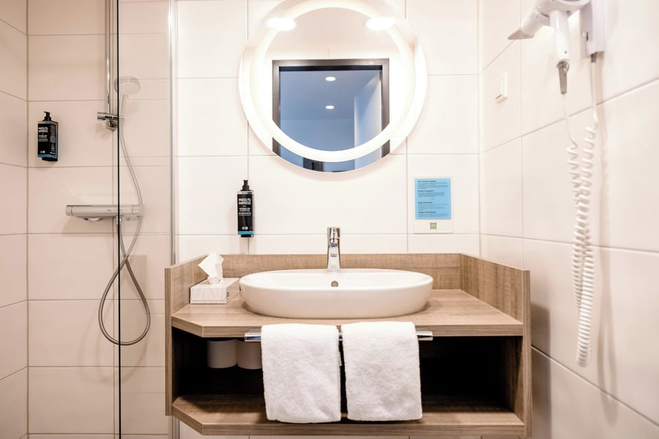 Shower, eco-friendly toiletries, towels, soap