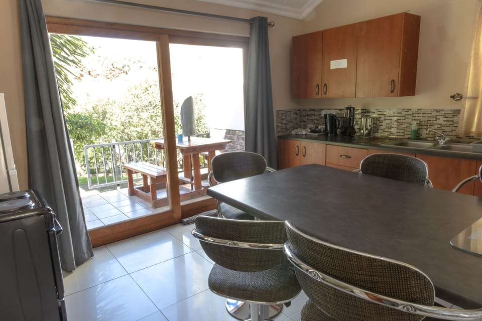 Family Apartment | Private kitchen | Full-size fridge, coffee/tea maker, electric kettle, cleaning supplies