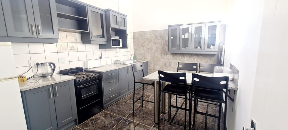 Honeymoon Apartment | Private kitchen | Full-size fridge, coffee/tea maker, electric kettle, cleaning supplies