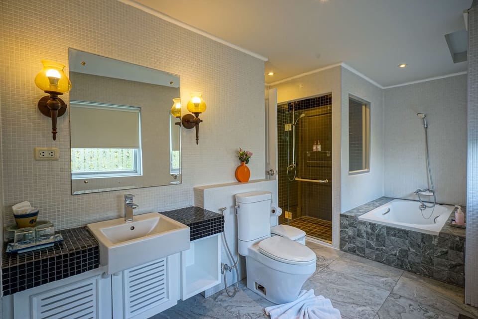Suite, 1 Bedroom | Bathroom | Shower, free toiletries, hair dryer, bathrobes