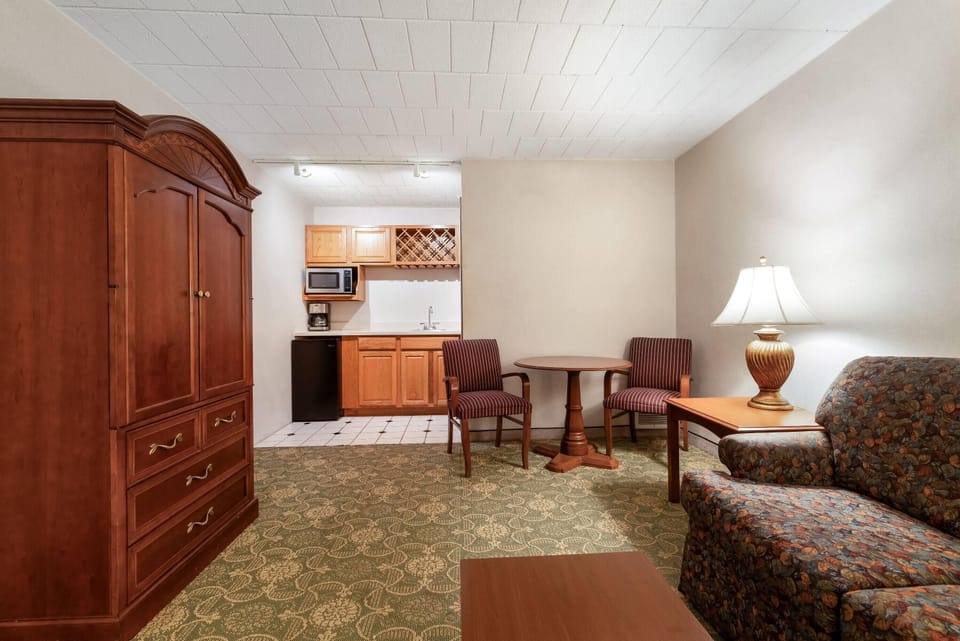 Suite, 1 King Bed, Non Smoking, No Windows | Laptop workspace, iron/ironing board, free cribs/infant beds, free WiFi