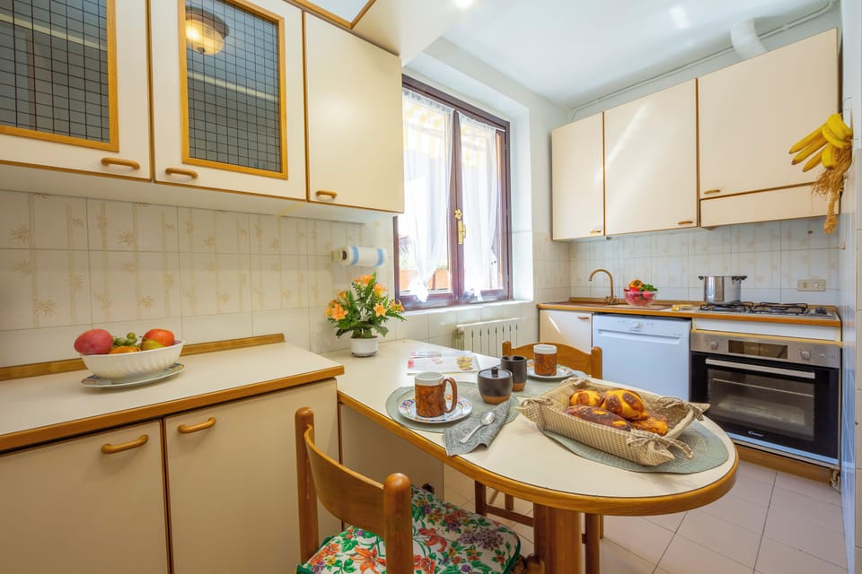 Family Apartment, Multiple Bedrooms (Appartamento Gaya Stresa Center) | Private kitchen | Fridge, oven, stovetop, dishwasher