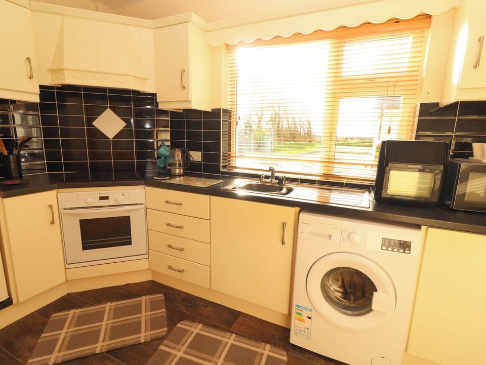Fridge, microwave, cookware/dishes/utensils