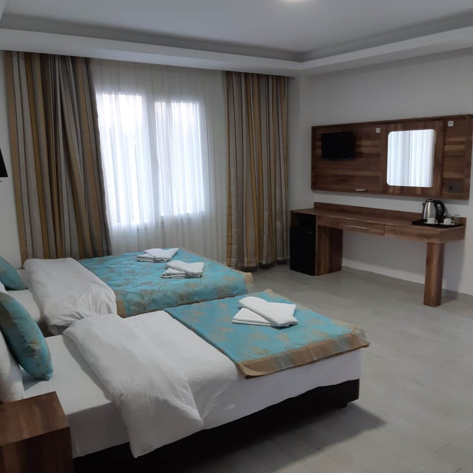 Family Triple Room | Minibar, in-room safe, WiFi (free), bed sheets