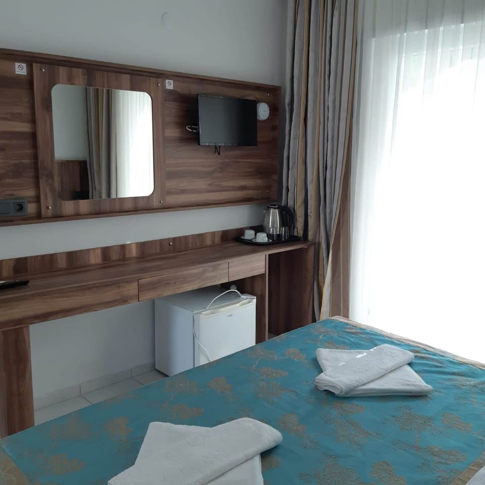 Family Triple Room | Minibar, in-room safe, WiFi (free), bed sheets