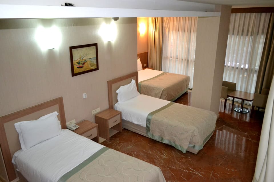 Family Quadruple Room | Soundproofing, iron/ironing board, free WiFi, bed sheets
