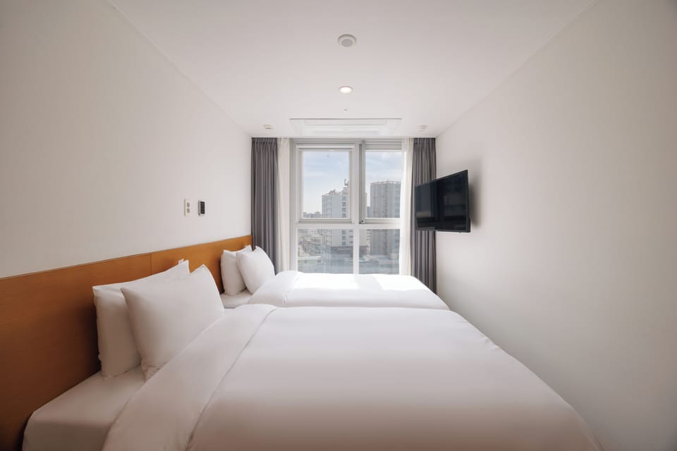 Laptop workspace, free WiFi, bed sheets
