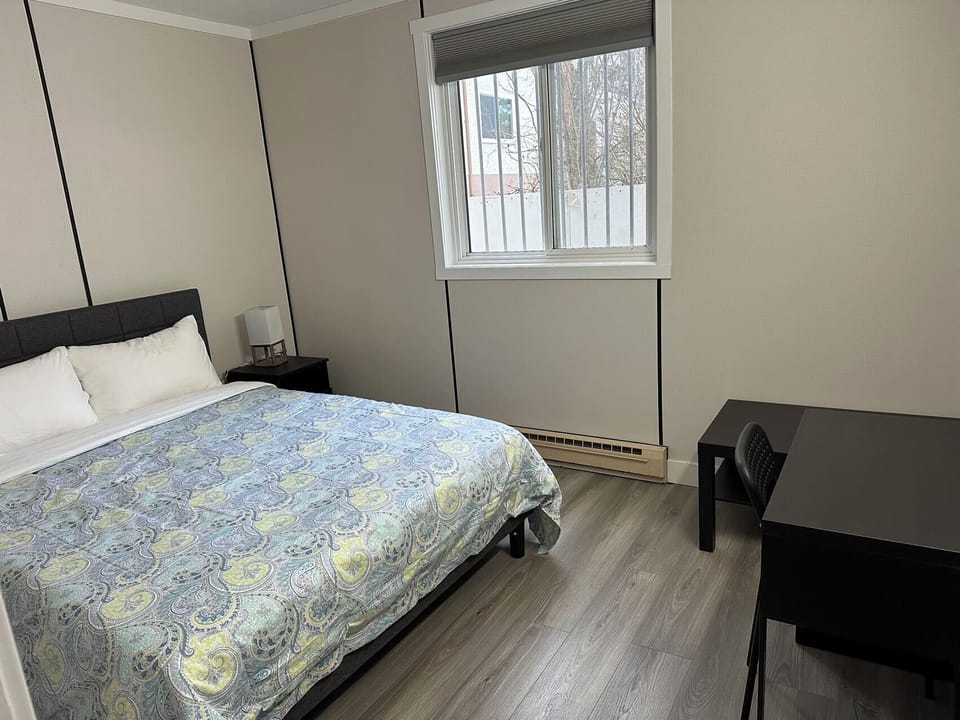 Desk, laptop workspace, bed sheets