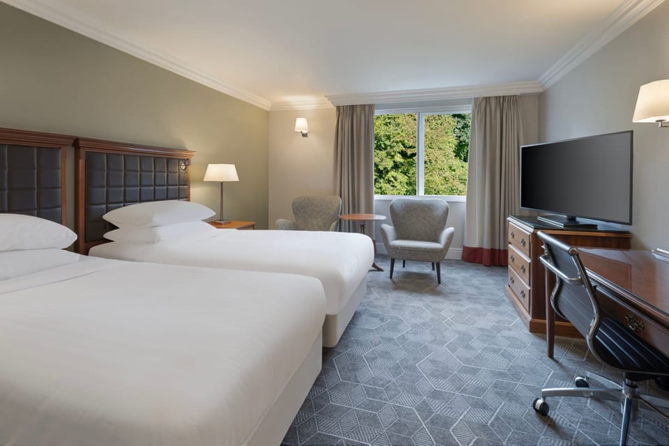 Deluxe Room, 2 Twin Beds | Pillowtop beds, in-room safe, desk, laptop workspace