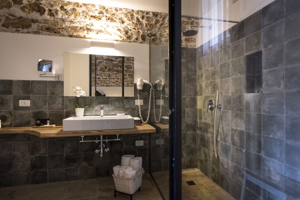 Superior Room, 1 Queen Bed, Courtyard Area, Adult only | Bathroom | Shower, hair dryer, slippers, bidet