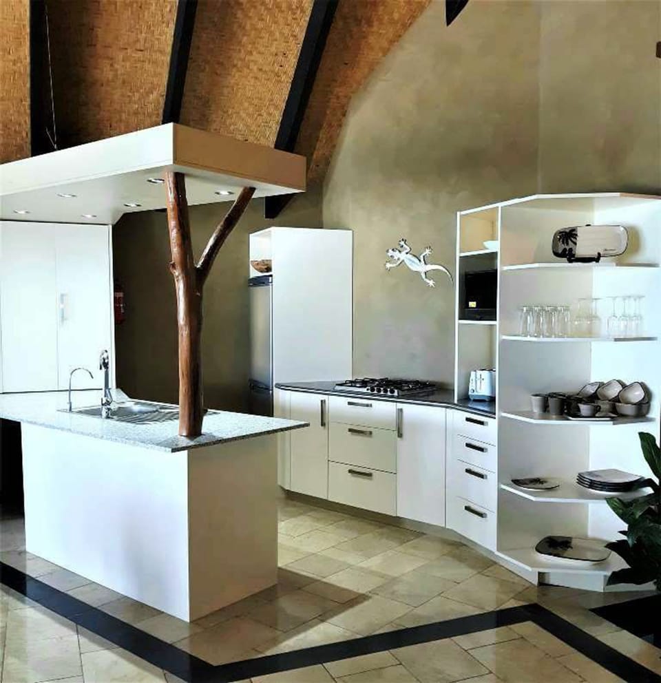 Beachfront Villa | Private kitchen | Coffee/tea maker, full-size fridge, microwave, stovetop
