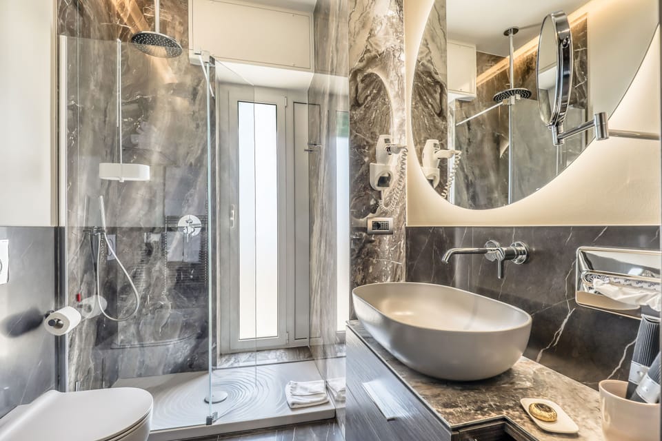 Junior Studio Suite, Sea View | Bathroom | Shower, hair dryer, towels, soap