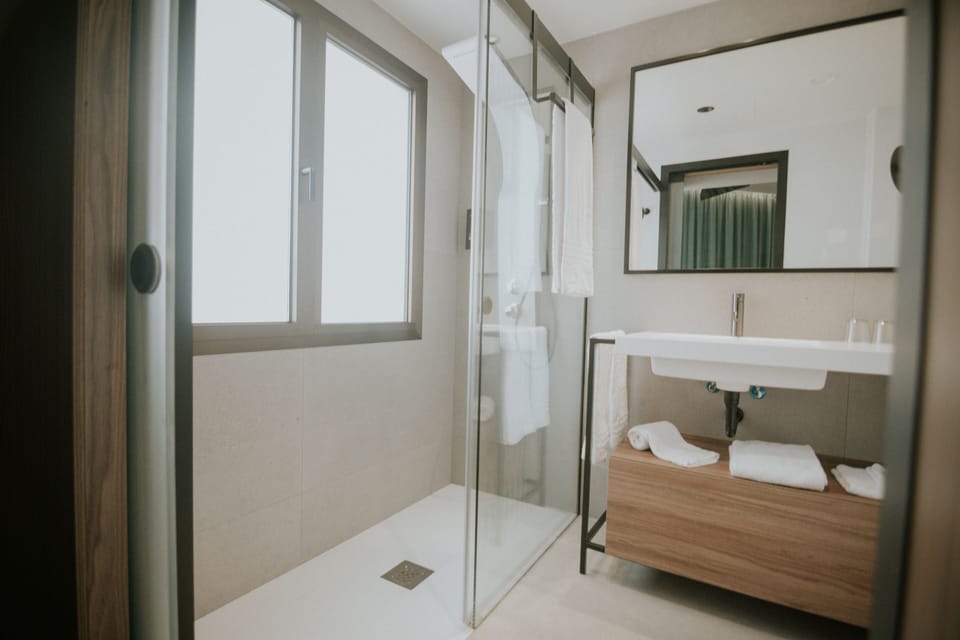 Bathtub, eco-friendly toiletries, towels