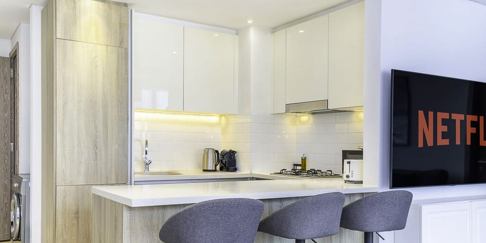Deluxe Apartment | Private kitchen | Espresso maker, full-size fridge, microwave, oven