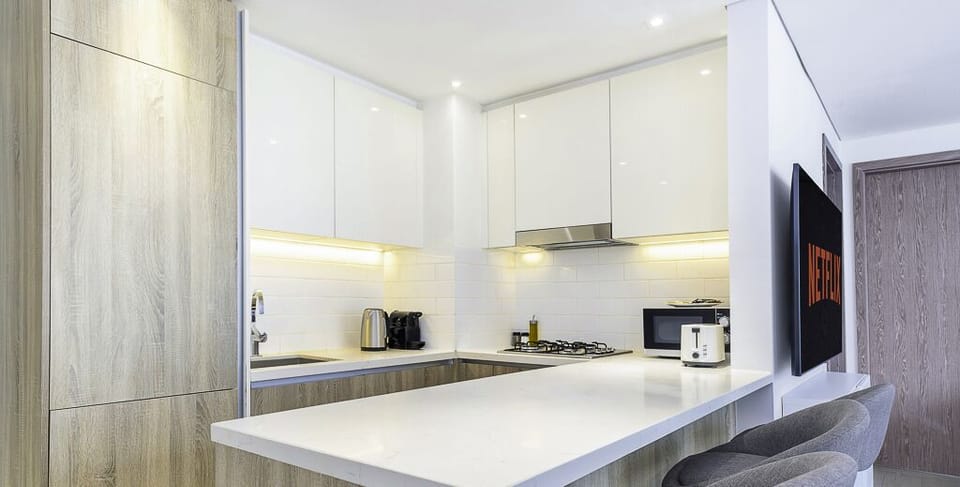 Deluxe Apartment | Private kitchen | Espresso maker, full-size fridge, microwave, oven