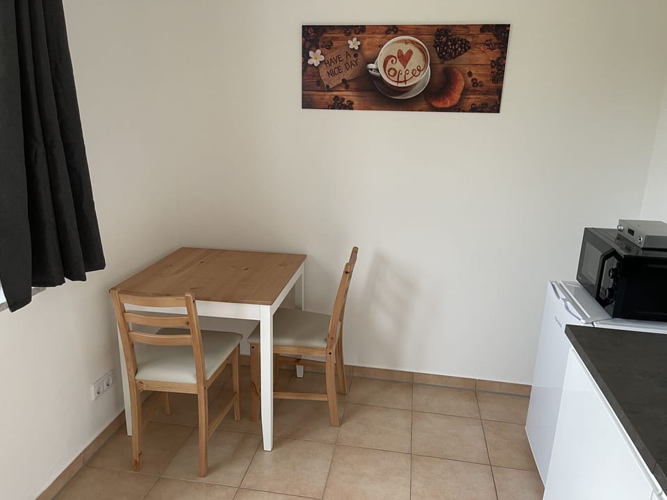 Basic Apartment | Living area | 28-inch LCD TV with satellite channels, TV