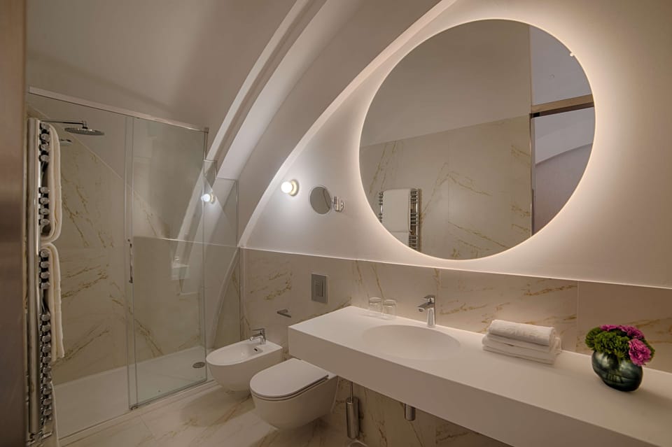 Rainfall showerhead, eco-friendly toiletries, hair dryer, bathrobes