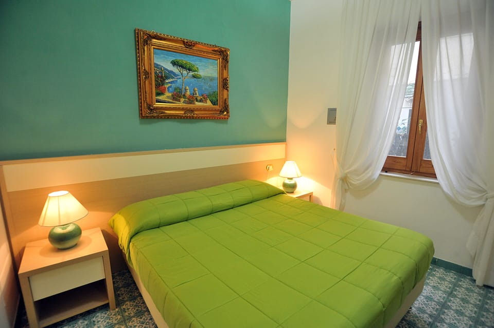 Economy Double Room | Minibar, in-room safe, individually furnished, desk