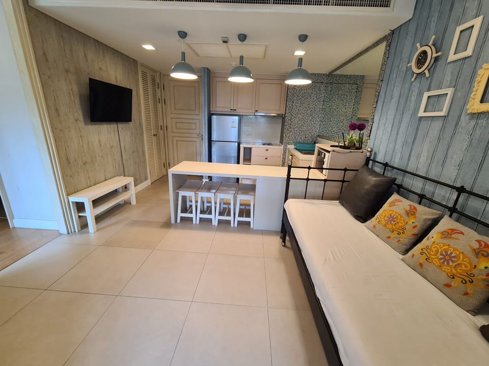 Family Condo, 1 Bedroom, Garden View | Living area | 40-inch flat-screen TV with digital channels, TV