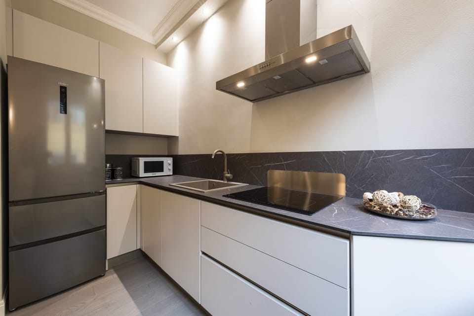 Deluxe Apartment, 1 Bedroom | Private kitchen | Full-size fridge, microwave, stovetop, dishwasher