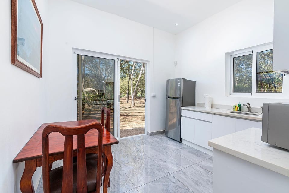 House, 4 Bedrooms | Private kitchen | Full-size fridge, microwave, stovetop, dishwasher