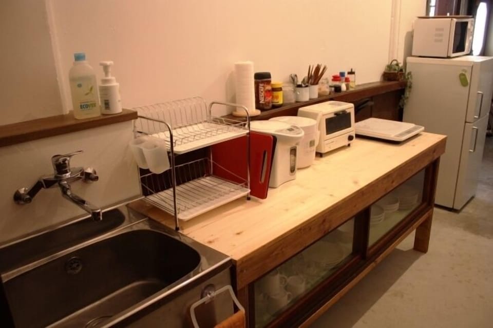 Fridge, microwave, coffee/tea maker, cookware/dishes/utensils