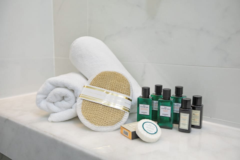 Shower, rainfall showerhead, designer toiletries, hair dryer
