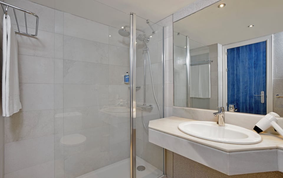 Shower, eco-friendly toiletries, hair dryer, towels