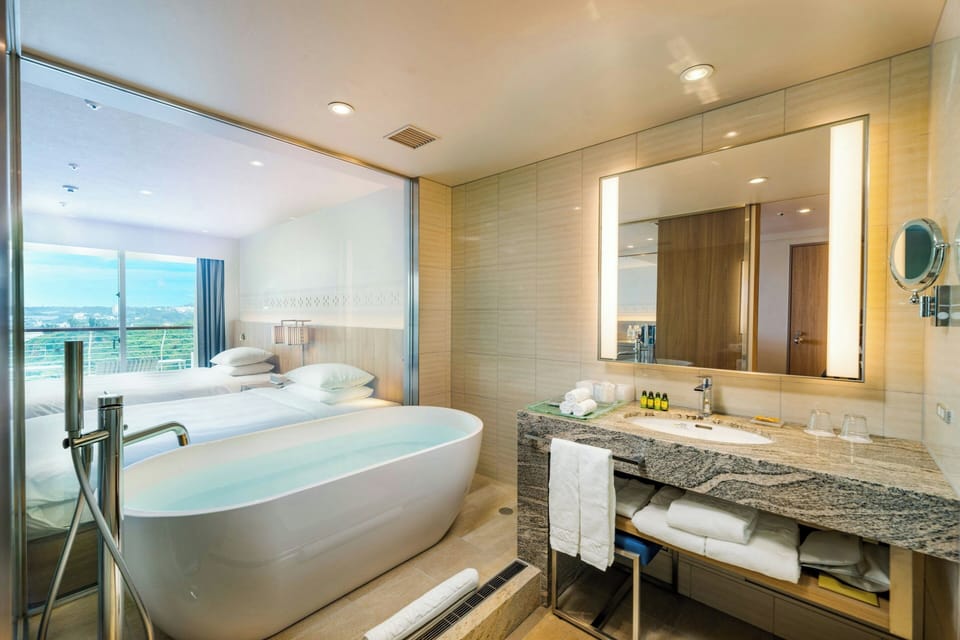 Club Twin Beach View Non Smoking | Bathroom | Combined shower/tub, free toiletries, hair dryer, bidet