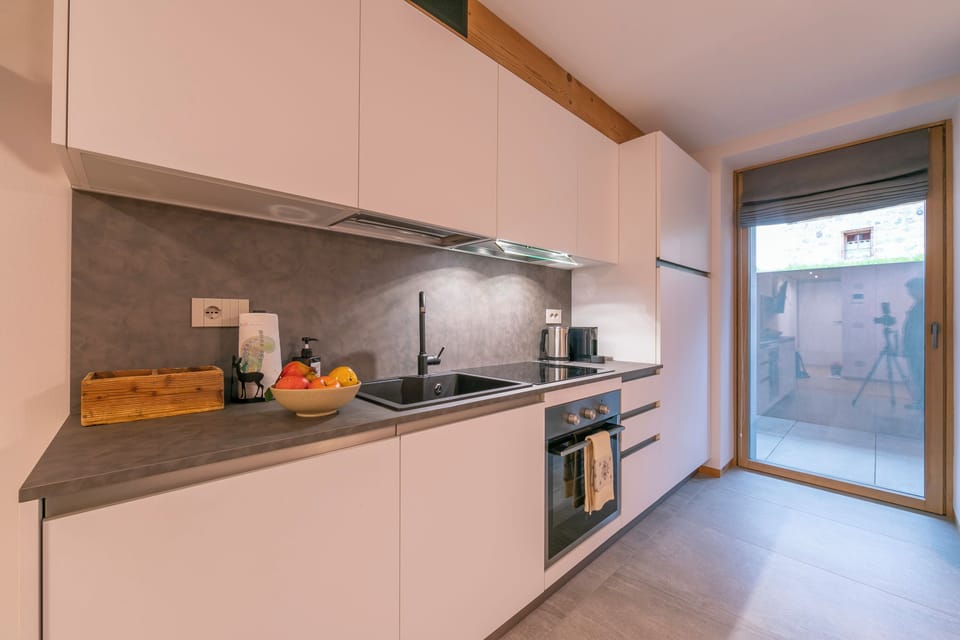 Family Studio, Microwave (Menina) | Private kitchen | Espresso maker, stovetop, electric kettle, dining table