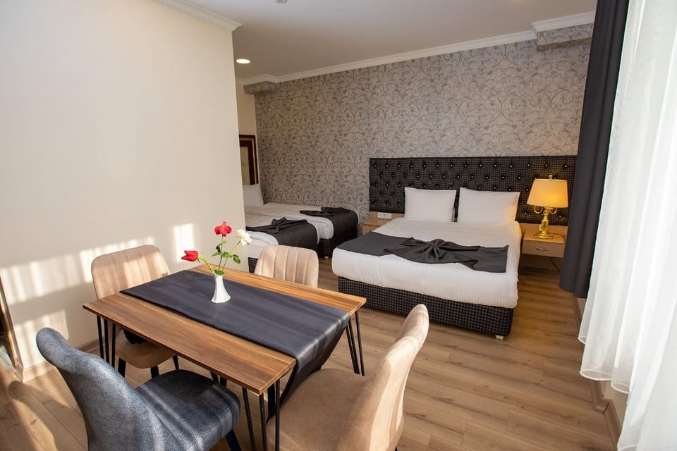 Triple Room, Garden View | Free minibar items, in-room safe, blackout drapes, soundproofing