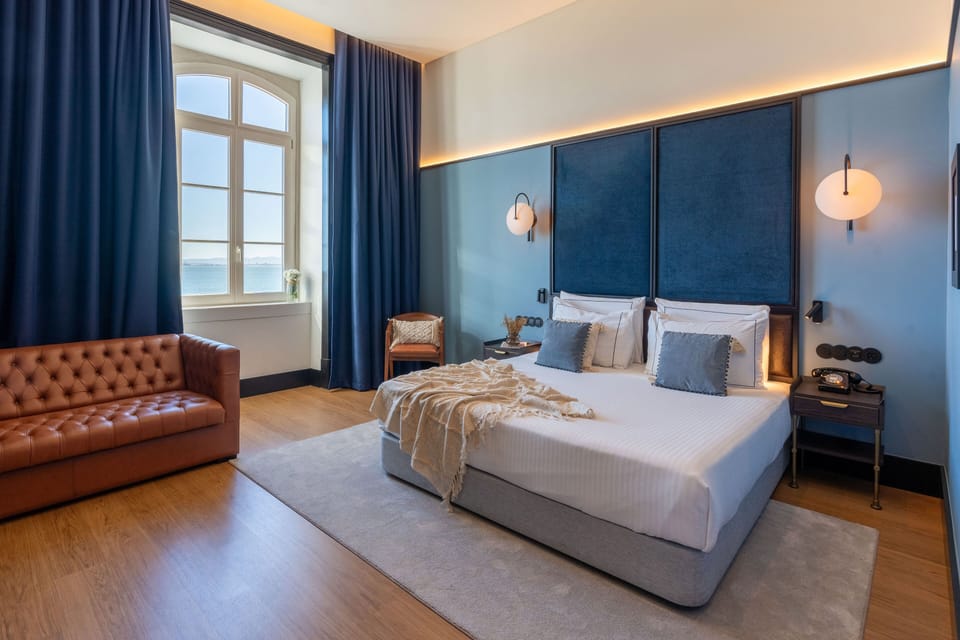 Junior Suite, River View | Minibar, in-room safe, desk, laptop workspace