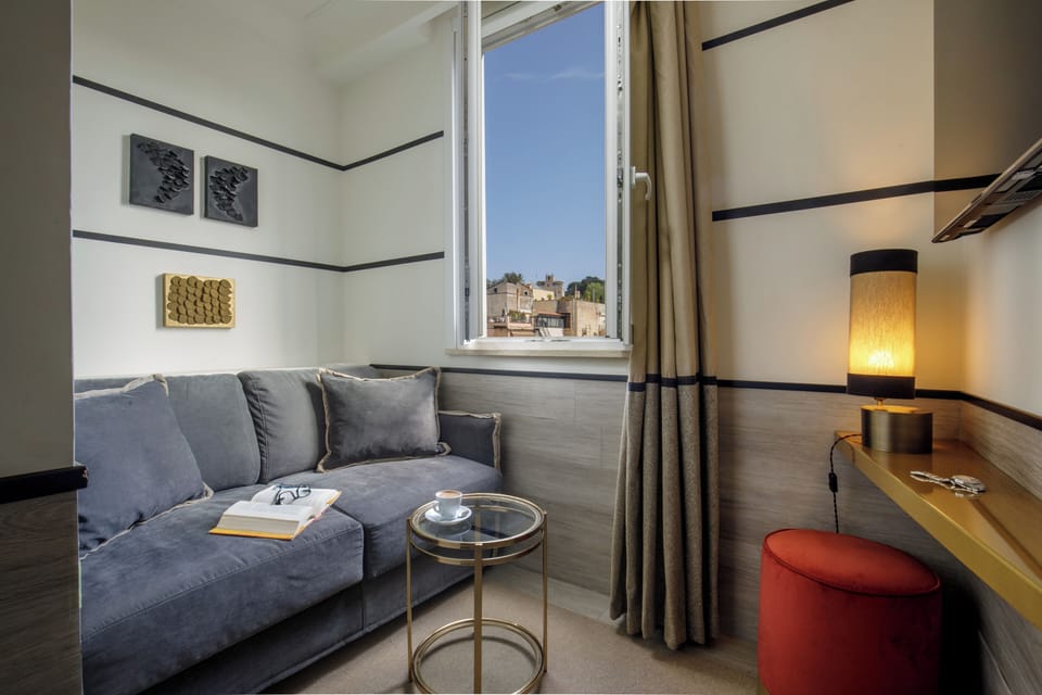 Junior Suite | Living area | 32-inch flat-screen TV with satellite channels, TV