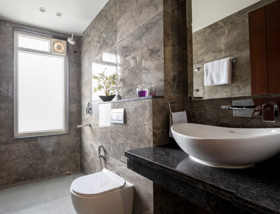 Executive Studio | Bathroom | Shower, hair dryer, slippers, towels