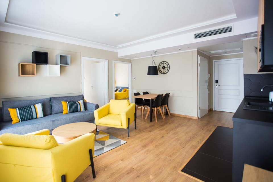 Family Apartment | Living area | 40-inch flat-screen TV with digital channels, TV