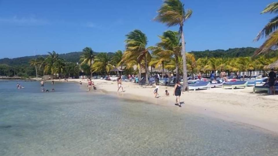 On the beach, white sand, free beach cabanas, sun loungers