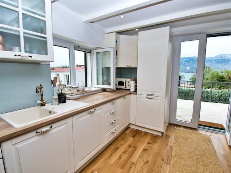 Family House, 2 Bedrooms, Sea View, Beachside | Private kitchen | Full-size fridge, microwave, oven, stovetop