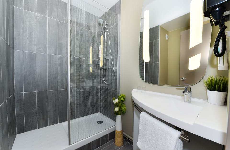 Shower, eco-friendly toiletries, hair dryer, towels